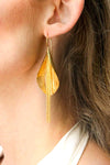 Shining gold-plated dangling earrings, like flowers,exuding elegance and sophistication