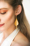 Shining gold-plated dangling earrings, like flowers,exuding elegance and sophistication